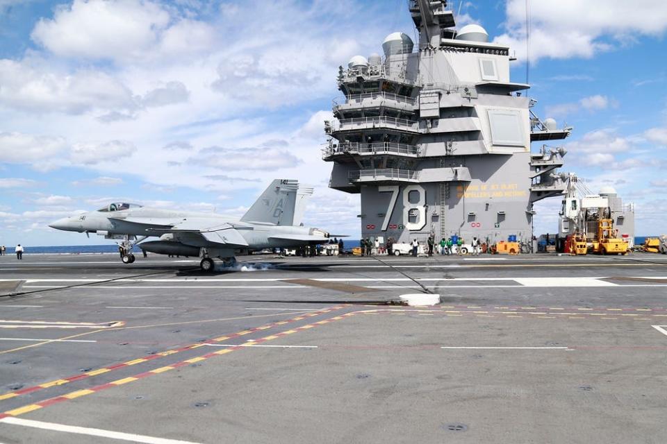 An F/A-18F Super Hornet assigned to the "Gladiators" of Strike Fighter Squadron (VFA) 106 makes an arrested landing on the flight deck of USS Gerald R. Ford (CVN 78) during flight operations in the Atlantic Ocean.