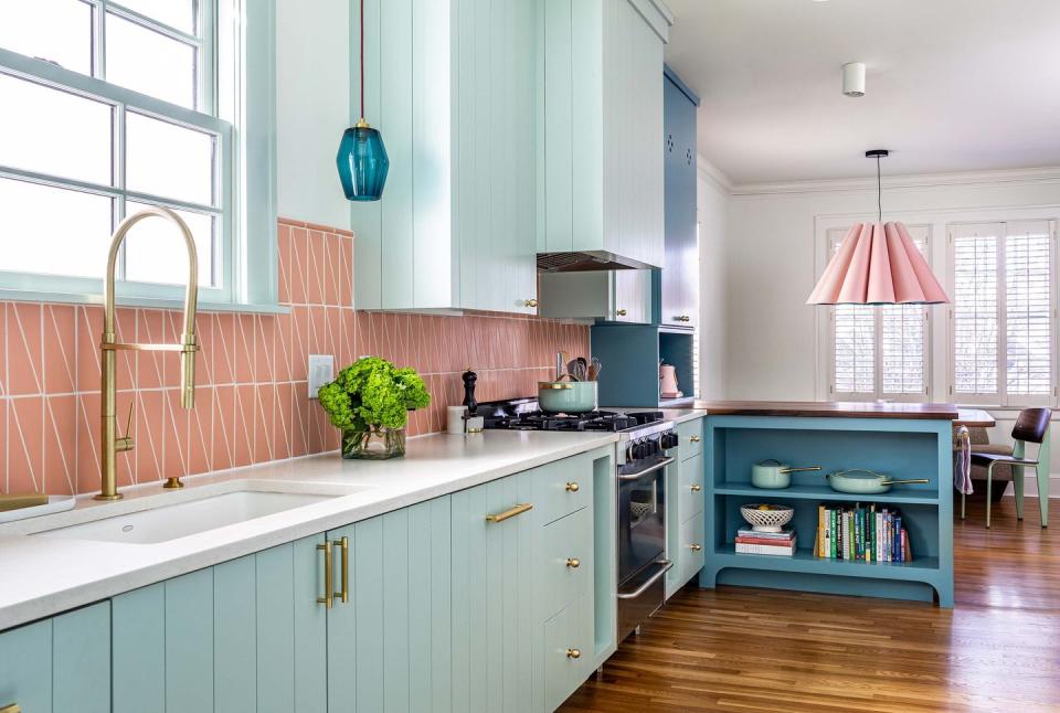 a kitchen with a stove and a chimney