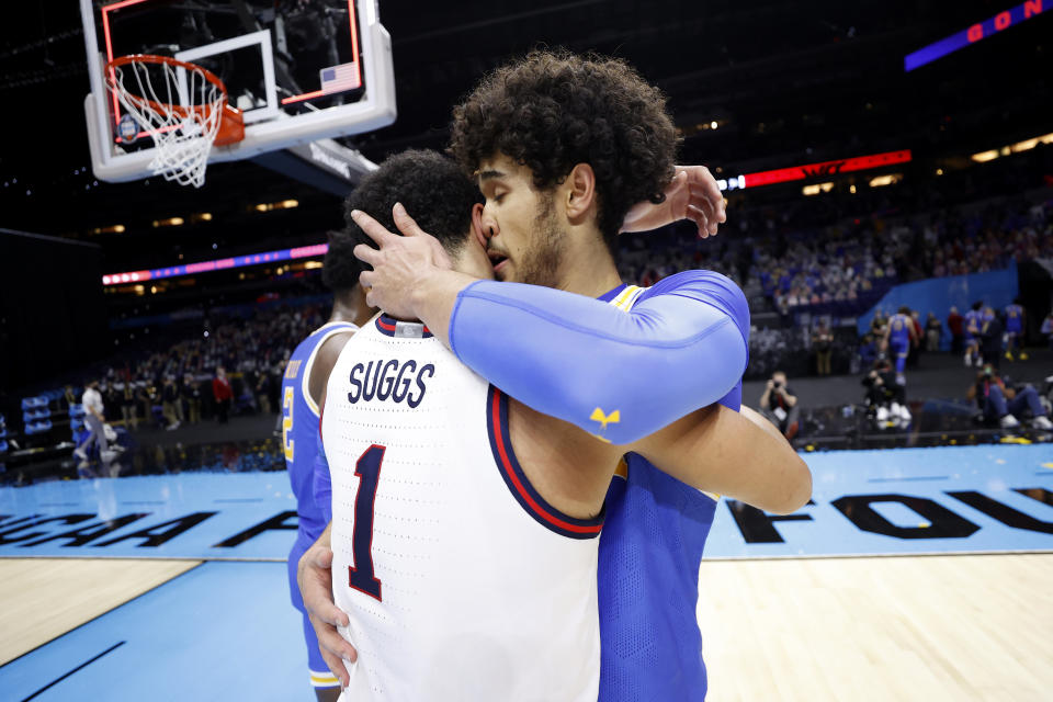 INDIANAPOLIS, INDIANA - APRIL 03: Jalen Suggs #1 of the Gonzaga Bulldogs hugs Johnny Juzang #3 of the UCLA Bruins after the Gonzaga Bulldogs defeated the UCLA Bruins 93-90 in overtime during the 2021 NCAA Final Four semifinal at Lucas Oil Stadium on April 03, 2021 in Indianapolis, Indiana. (Photo by Jamie Squire/Getty Images)