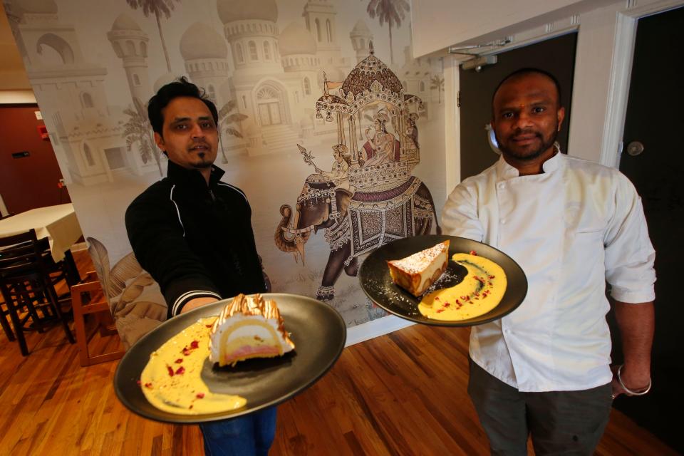 Ranjan Shinde, pastry chef, and Roshan Patil, head chef, hold up some uniquely Indian desserts at the newly opened Saffron by the Sea in Fairhaven.