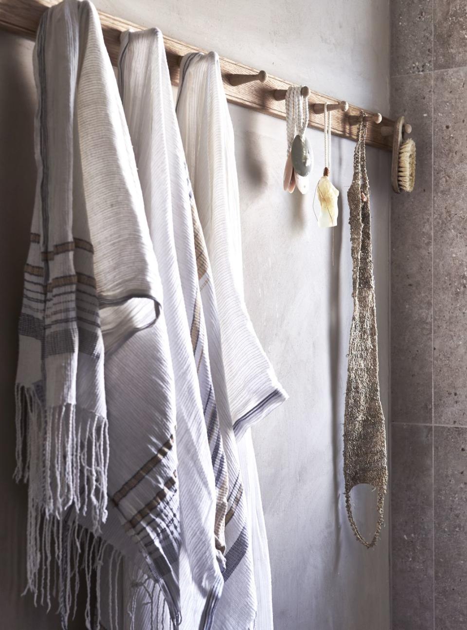 linens hanging on a peg rail