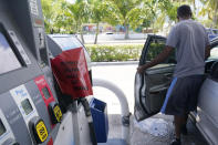 A customer leaves a Chevron station after it ran out of gasoline, Wednesday, May 12, 2021, in Miami. State and federal officials are scrambling to find alternate routes to deliver gasoline in the Southeast U.S. after a hack of the nation's largest fuel pipeline led to panic-buying that contributed to more than 1,000 gas stations running out of fuel. The pipeline runs from the Gulf Coast to the New York metropolitan region, but states in the Southeast are more reliant on the pipeline for fuel. Other parts of the country have more sources to tap. (AP Photo/Marta Lavandier)