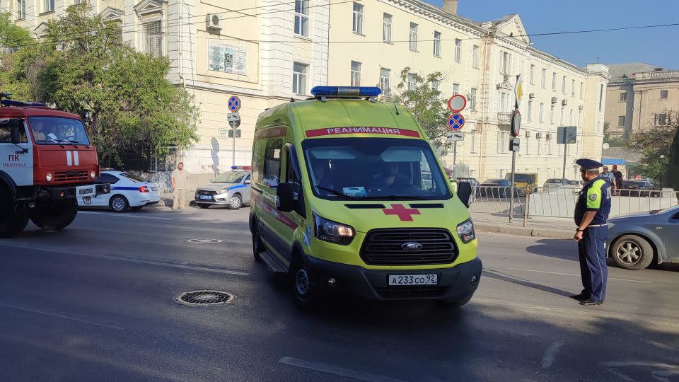 An ambulance leaves the area next to the shipyard in Sevastopol, Crimea, on September 13, 2023. - Stringer/Reuters