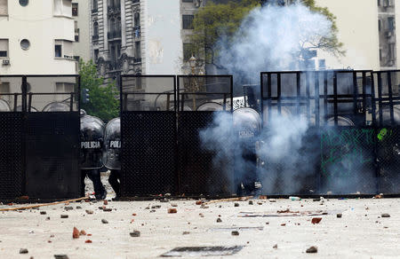 Riot policemen fire tear gas during clashes outside the Congress, where the budget bill is being debated, in Buenos Aires, Argentina October 24, 2018. REUTERS/Martin Acosta