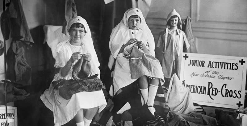 Two Young Girls Knitting as part of Junior Activities of the New Orleans Chapter of American Red Cross, New Orleans, Louisiana, USA, American National Red Cross Photograph Collection, September 1918 (Photo by: Universal History Archive/Universal Images Group via Getty Images)