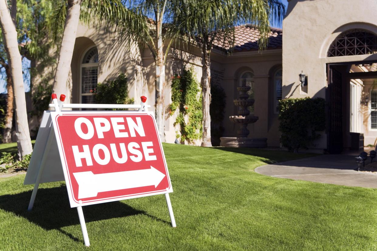 'Open House' sign on front yard of home