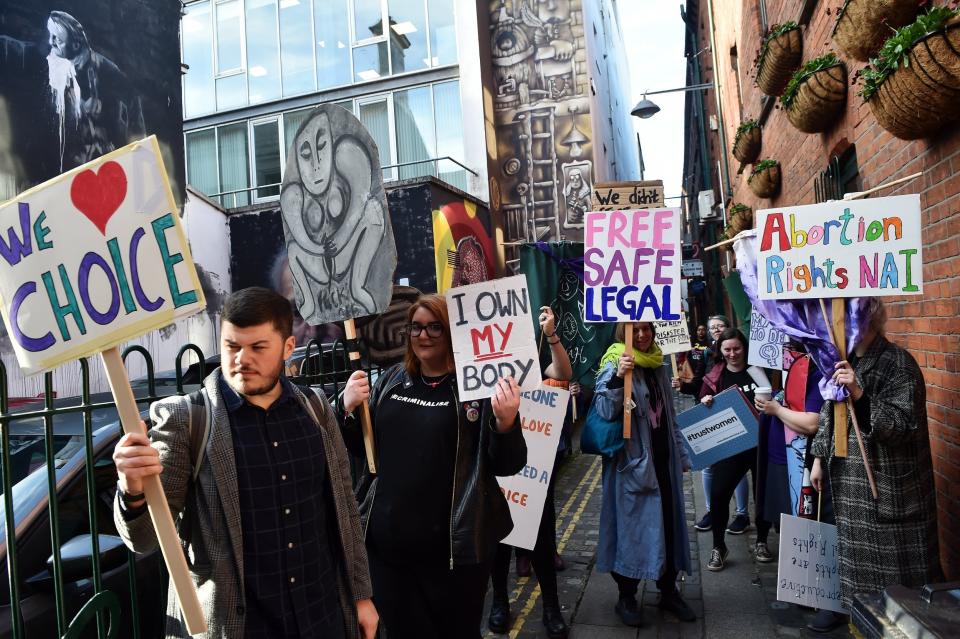 Abortion-rights demonstrators march through the streets of Belfast today (Getty Images)