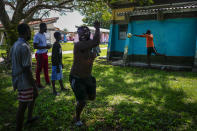 A Haitian celebrates his goal during a game at a campground being used to house a large group of Haitian migrants in Sierra Morena in Cuba's Villa Clara province, Thursday, May 26, 2022. A vessel carrying more than 800 Haitians trying to reach the United States wound up instead on the coast of central Cuba, in what appeared to be the largest group seen yet in a swelling exodus from crisis-stricken Haiti. (AP Photo Ramon Espinosa)