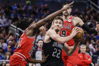 Orlando Magic forward Franz Wagner (22) drives to basket against Chicago Bulls guard Ayo Dosunmu (12) during the first half of an NBA basketball game Saturday, Jan. 28, 2023, in Orlando, Fla. (AP Photo/Kevin Kolczynski)