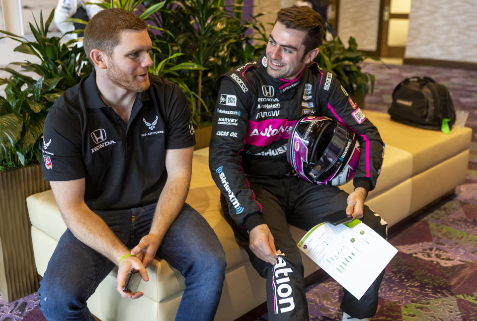 IndyCar driver Conor Daly, left, and Jack Harvey speak during IndyCar auto racing media day, Monday, Feb. 11, 2019, in Austin, Texas. (AP Photo/Stephen Spillman)