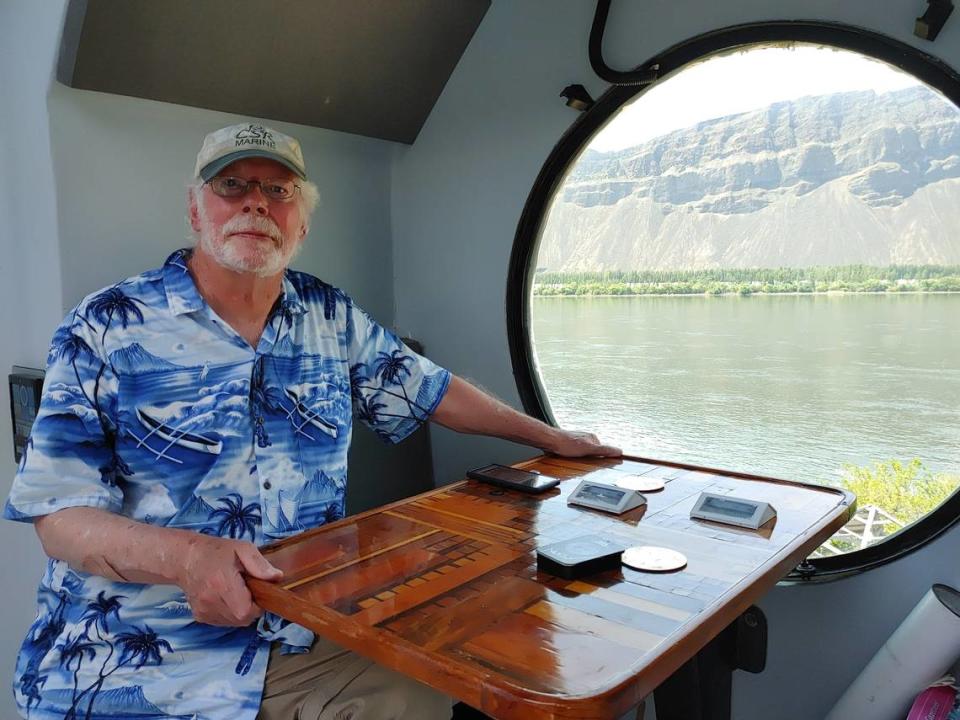 Kurt Hughes, a Seattle naval architect, sits at Captain Nemo’s window in the lunar lander tiny house he built as a getaway at Beverly, Wash., on the Columbia River. Wendy Culverwell/Tri-City Herald
