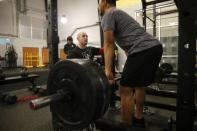 WWE wrestler Bin Wang (R) of China works with trainer Sean Hayes at the WWE Performance Center in Azalea Park, Florida, December 1, 2016. REUTERS/Scott Audette