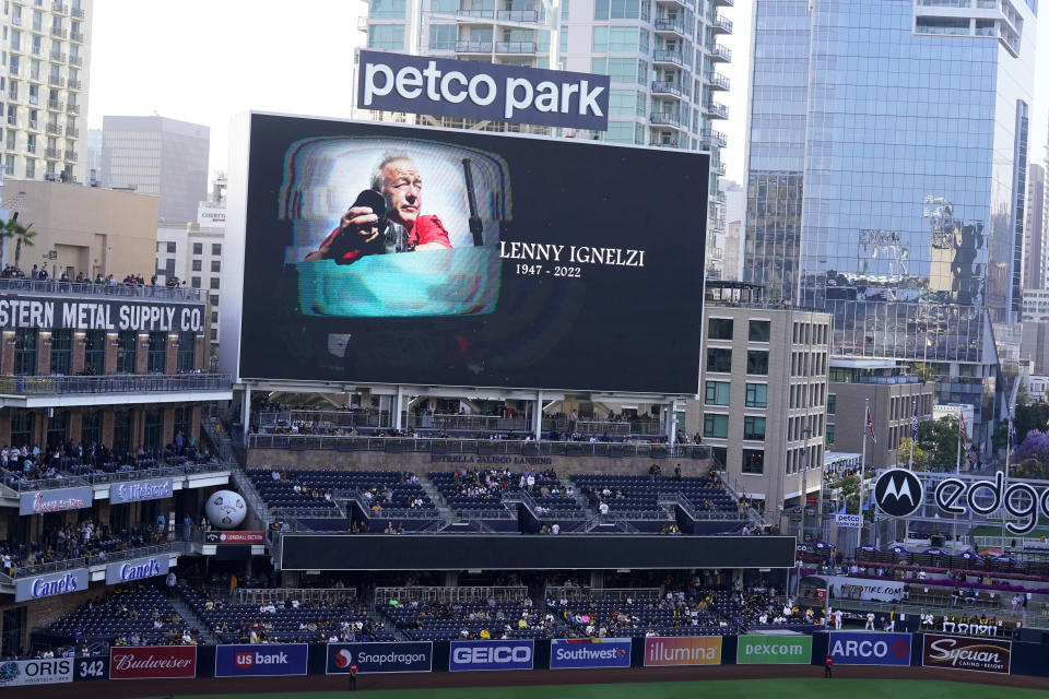 An image of former Associated Press photographer Lenny Ignelzi is displayed during a moment of silence in his honor, before the San Diego Padres host the Miami Marlins in a baseball game at Petco Park, Thursday, May 5, 2022, in San Diego. Ignelzi, a staff photographer for the AP in San Diego for nearly 40 years, died April 29. (AP Photo/Gregory Bull)