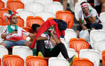 <p>Iran fans look dejected after the match. REUTERS/Matthew Childs </p>