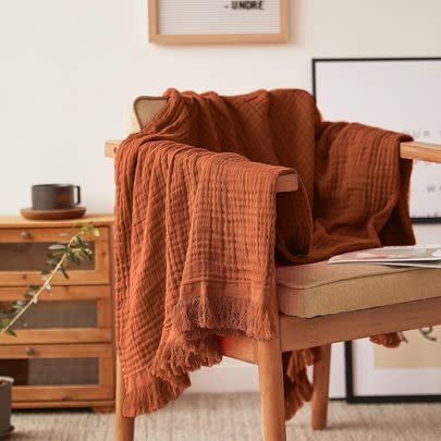 Or a cotton muslin throw with tassels so you can fill your home with autumnal colors