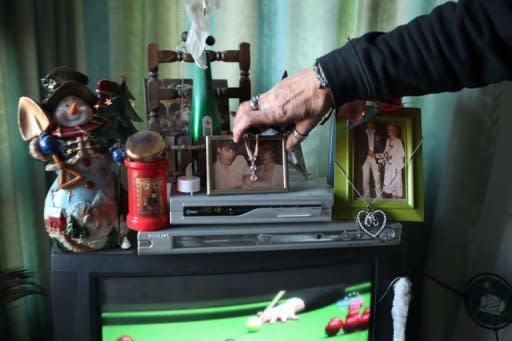 Ronald Zwennes shows wedding photo with his first wife, who died of cancer, in his apartement at Woodstock nursing home for addicts in The Hague, Netherlands, on January 2, 2012. Woodstock opened in December 2008 and gives shelter and support to 37 homeless and drug addicts with 24 hour daily support in a team of twenty care workers