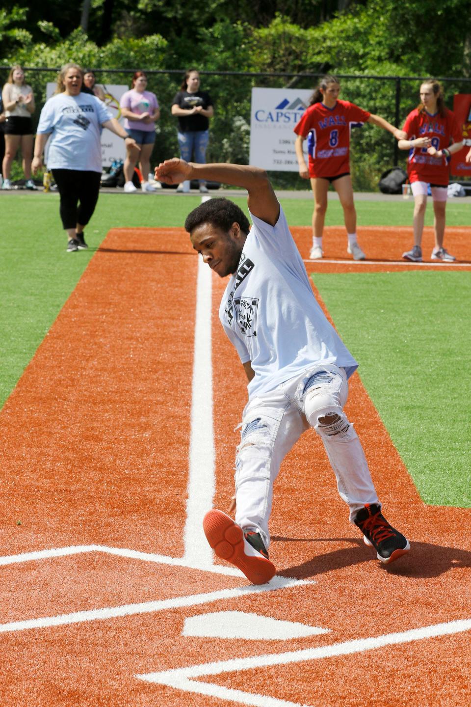 Toms River East Unified's Keynen Hardy makes an artful slide into home during kick ball game against Wall Unified at the Toms River Field of Dreams Tuesday, May 16, 2023.
