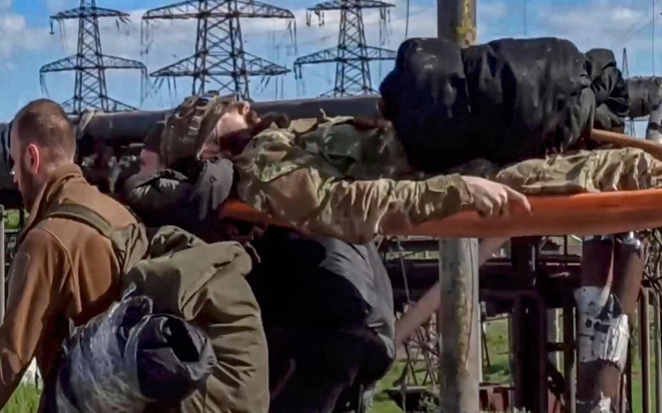 Injured soldiers being evacuated - RUSSIAN DEFENCE MINISTRY PRESS SERVICE HANDOUT/EPA-EFE/Shutterstock