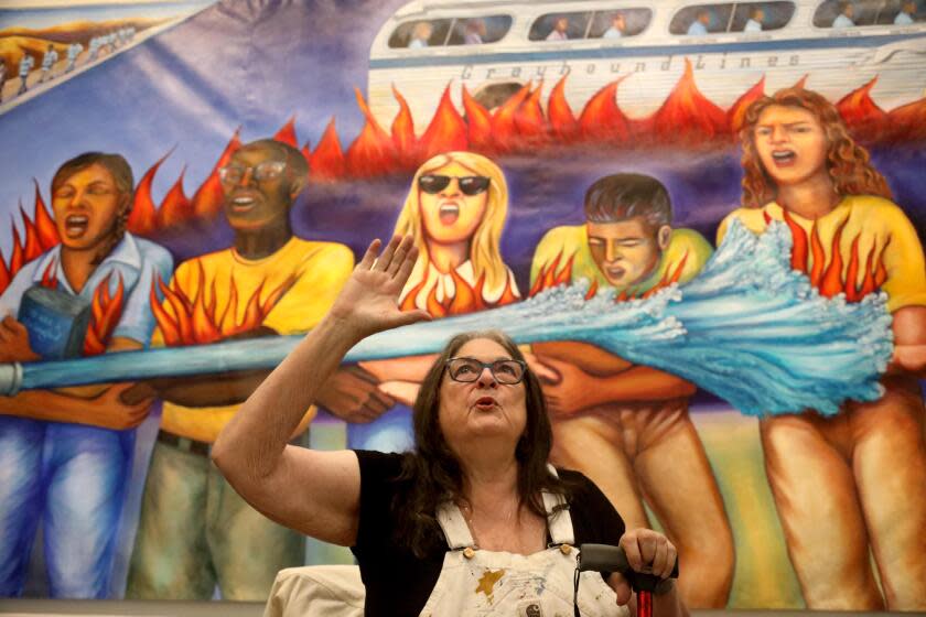 LOS ANGELES, CA - OCTOBER 26, 2023 - Artist Judy Baca talks to the media in front of a rendition of her new mural, "Generation on Fire, " that is part of her exhibition, "Painting in the River of Angels: Judy Baca and The Great Wall," at the Los Angeles County Museum of Art (LACMA) in Los Angeles on October 26, 2023. In the mural, "Generation on Fire," Baca memorializes an interracial group of activists known as the Freedom Riders. The mural will be added to, "The Great Wall of Los Angeles." (Genaro Molina / Los Angeles Times)