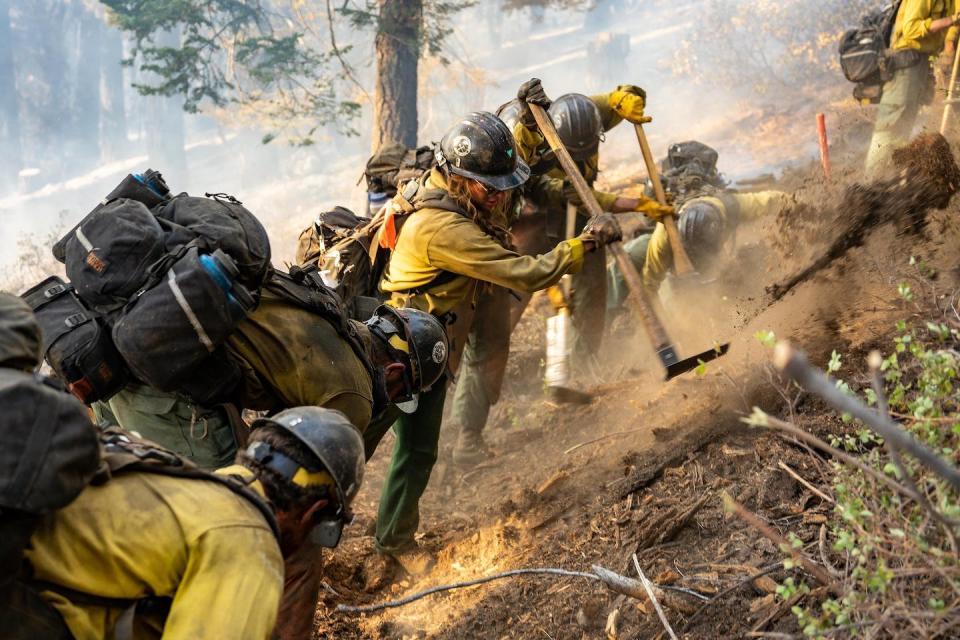 Ruby Mountain Hotshots construct a fireline during the Dixie Fire in 2021. <a href="https://www.flickr.com/photos/nifc/51434898834" rel="nofollow noopener" target="_blank" data-ylk="slk:Joe Bradshaw/BLM;elm:context_link;itc:0;sec:content-canvas" class="link ">Joe Bradshaw/BLM</a>