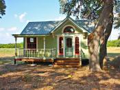 <p>Painted with six colors, The Painted Lady is an intricately designed micro farmhouse in Round Top, Texas, from <a href="http://tinytexashouses.com/" rel="nofollow noopener" target="_blank" data-ylk="slk:Tiny Texas Houses;elm:context_link;itc:0;sec:content-canvas" class="link ">Tiny Texas Houses</a>. With a Victorian style exterior, the interior measures 12- by 26-feet and features a built-in couch, full kitchen, Murphy bed, sleeping loft, and bathroom with a glassed-in shower with a river rock floor. The home is 99 percent pure salvage, including the beams, floor joists, studs, windows, doors, and interior and exterior skins.</p>