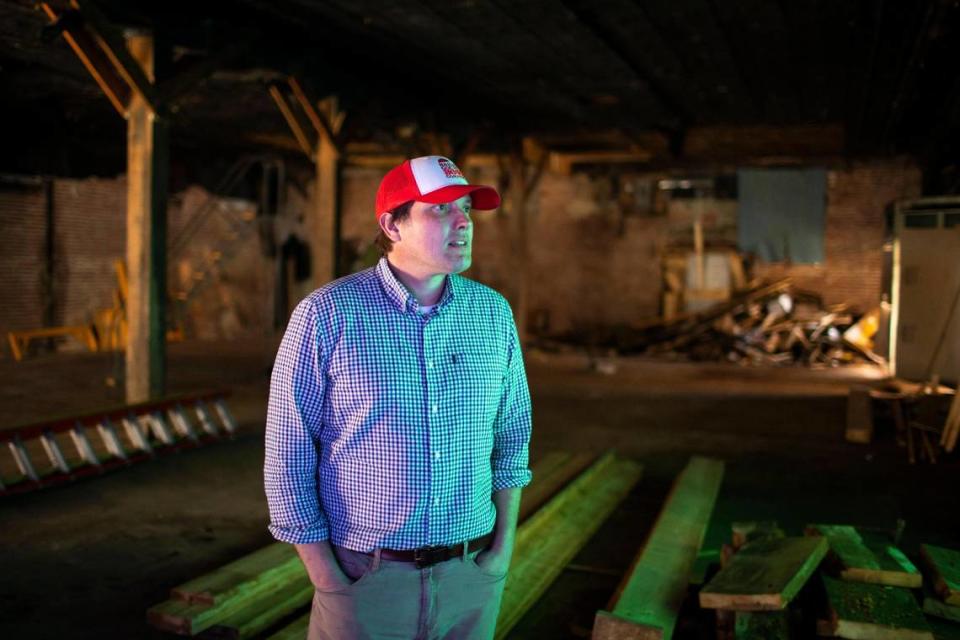 Geoff Marietta poses in 2021 for a portrait in the Harlan County Beer Company building, in Harlan, Ky. The business opened in 2022.