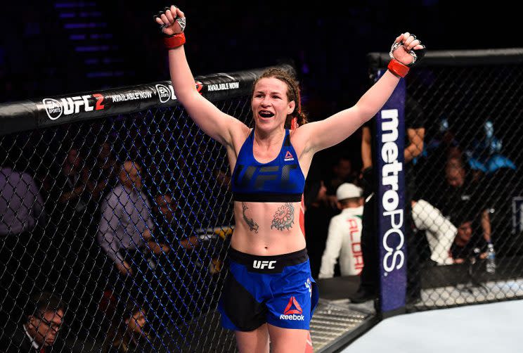 Leslie Smith raises her hands after facing Irene Aldana in their women's bantamweight bout during a UFC Fight Night event on December 17, 2016. (Getty)