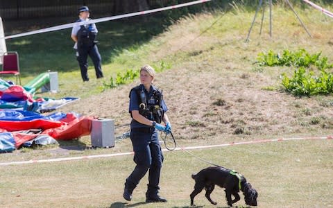 Police search in Jubilee Park, Edmonton, following the fatal stabbing of a 29-year-old man. - Credit: Rick Findler/PA