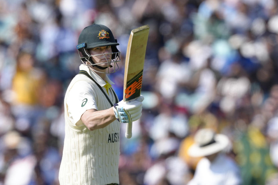 Australia's Steven Smith celebrates getting 50 runs not out on the first day of the ICC World Test Championship Final between India and Australia at The Oval cricket ground in London, Wednesday, June 7, 2023. (AP Photo/Kirsty Wigglesworth)