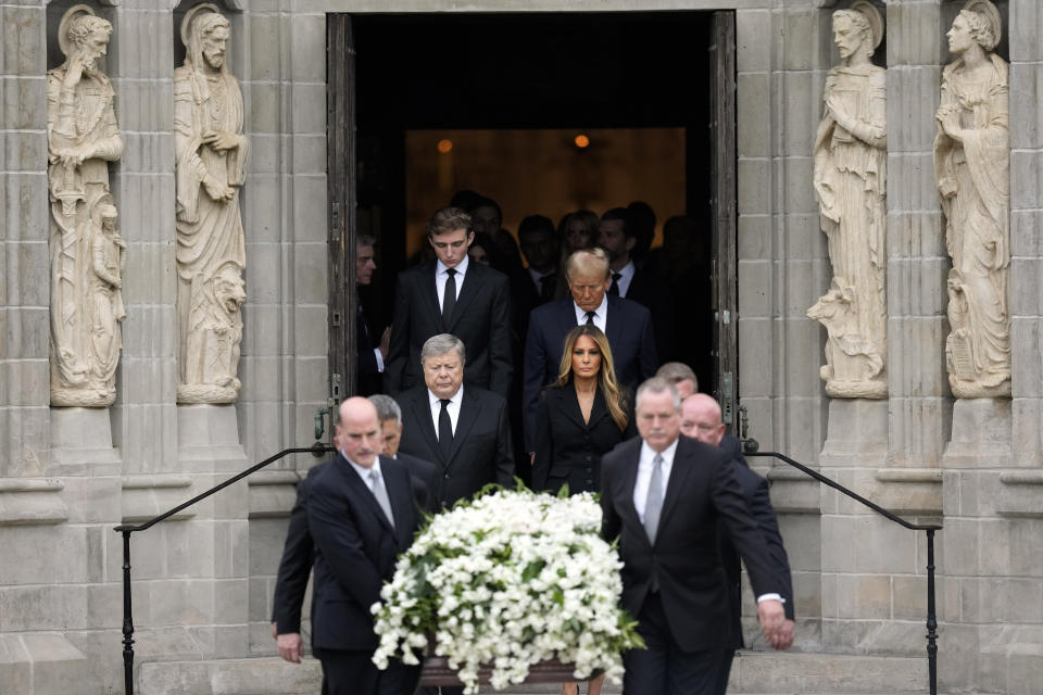 Former first lady Melania Trump, center right, and her father Viktor Knavs, center left, are followed by former President Donald Trump, back right, and son Barron, back left, as they exit behind the coffin of the former first lady's mother Amalija Knavs, Thursday, Jan. 18, 2024, at Church of Bethesda-by-the-Sea in Palm Beach, Fla. (AP Photo/Rebecca Blackwell)