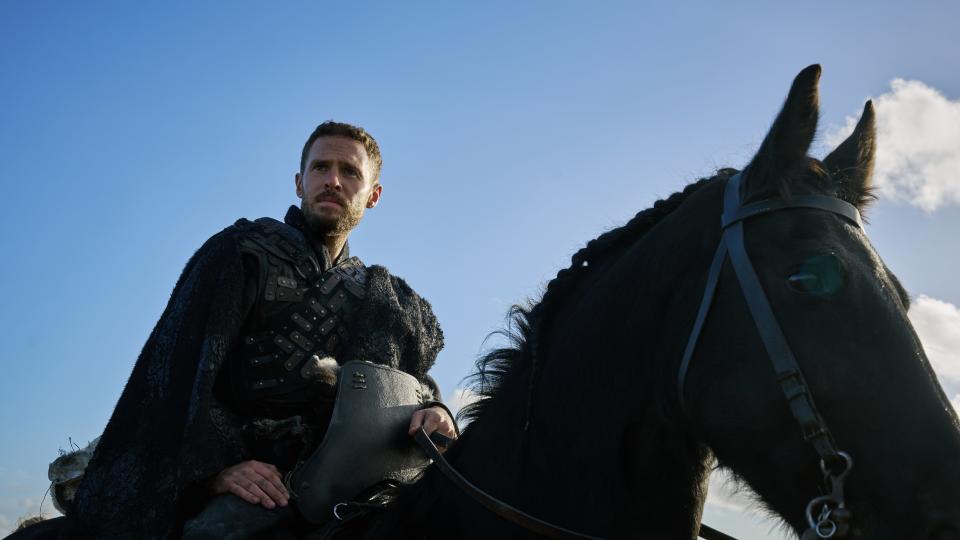 Iain De Caestecker as Arthur on a horse in The Winter King.