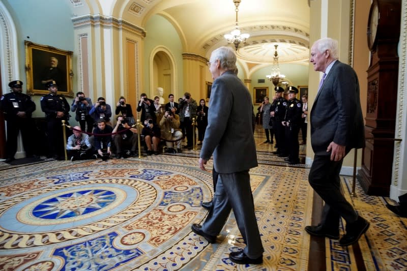 FILE PHOTO: Senate Majority Leader McConnell and Senator Cornyn arrive for the beginning of the Trump impeachment trial in Washington