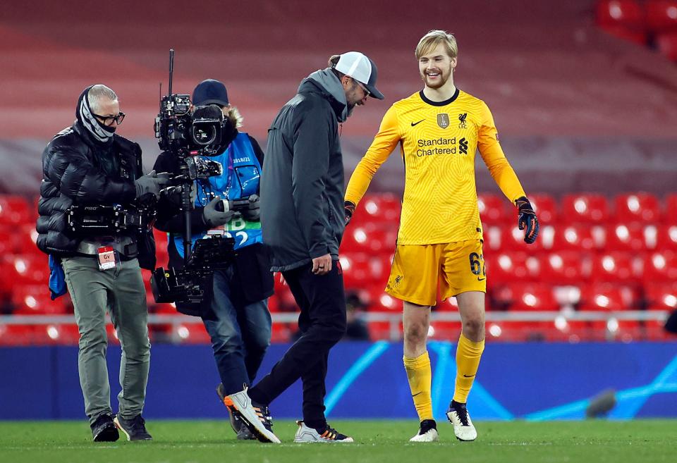 Jurgen Klopp goes to congratulate his young goalkeeper Caoimhin Kelleher (PA)