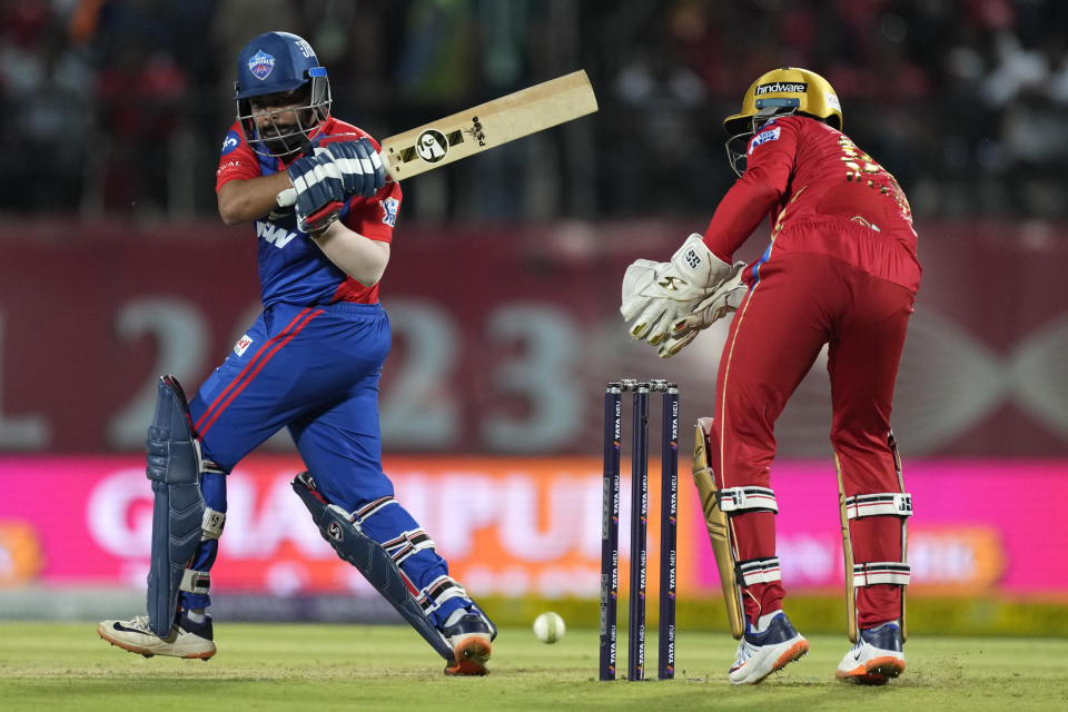 Delhi Capitals' Prithvi Shaw, left, plays a shot during the Indian Premier League cricket match between Punjab Kings and Delhi Capitals in Dharamshala, India, Wednesday, May 17, 2023. (AP Photo /Ashwini Bhatia)