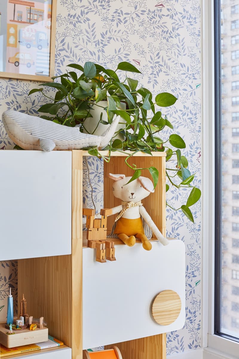 Stuffed animals displayed on shelves in nursery.