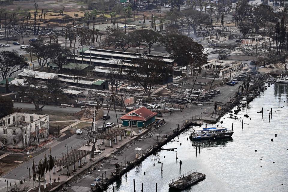 An aerial image taken on August 10, 2023 shows destroyed homes, buildings and boats burned to the ground in Lahaina in the aftermath of wildfires in western Maui, Hawaii. At least 36 people have died after a fast-moving wildfire turned Lahaina to ashes, officials said August 9, 2023 as visitors asked to leave the island of Maui found themselves stranded at the airport. The fires began burning early August 8, scorching thousands of acres and putting homes, businesses and 35,000 lives at risk on Maui, the Hawaii Emergency Management Agency said in a statement. (Photo by Patrick T. Fallon / AFP) (Photo by PATRICK T. FALLON/AFP via Getty Images)