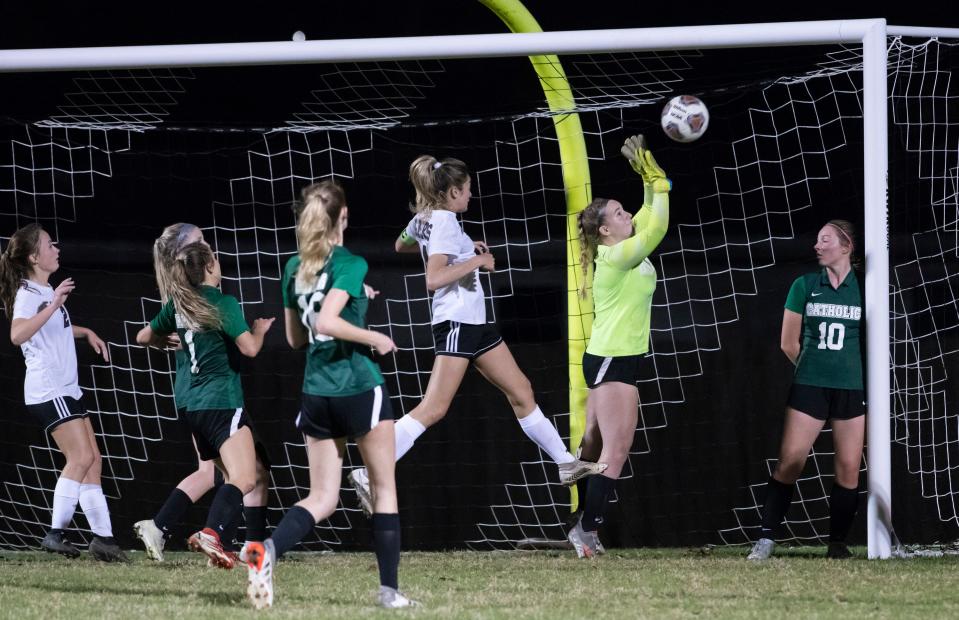 Crusaders goal keeper Ellie Newstead (0) makes a save during the Pensacola vs Catholic girls soccer game at Pensacola Catholic High School on Tuesday, Dec. 7, 2021.