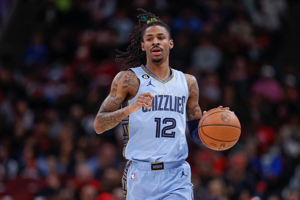 Apr 2, 2023; Chicago, Illinois, USA; Memphis Grizzlies guard Ja Morant (12) brings the ball up court against the Chicago Bulls during the first half at United Center. Mandatory Credit: Kamil Krzaczynski-USA TODAY Sports