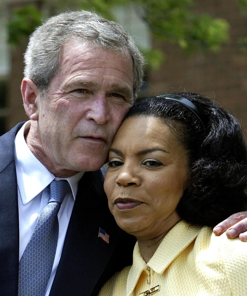 US President George W. Bush hugs Cheryl Brown Henderson, President & CEO of the Brown Foundation for Education Equity, Excellence and Research, 17 May 2004 during 50th Anniversary celebrations at the Brown v. Board of Education National Historic Site Grand Opening in Topeka, Kansas. AFP Photo/Paul J. Richards ORG XMIT: PJR01