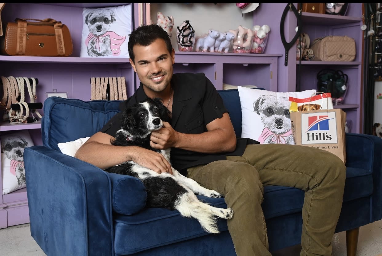 Lautner with one of two dogs he shares with fiancée Taylor Dome, Lily. (Photo: Hill's Pet Nutrition)