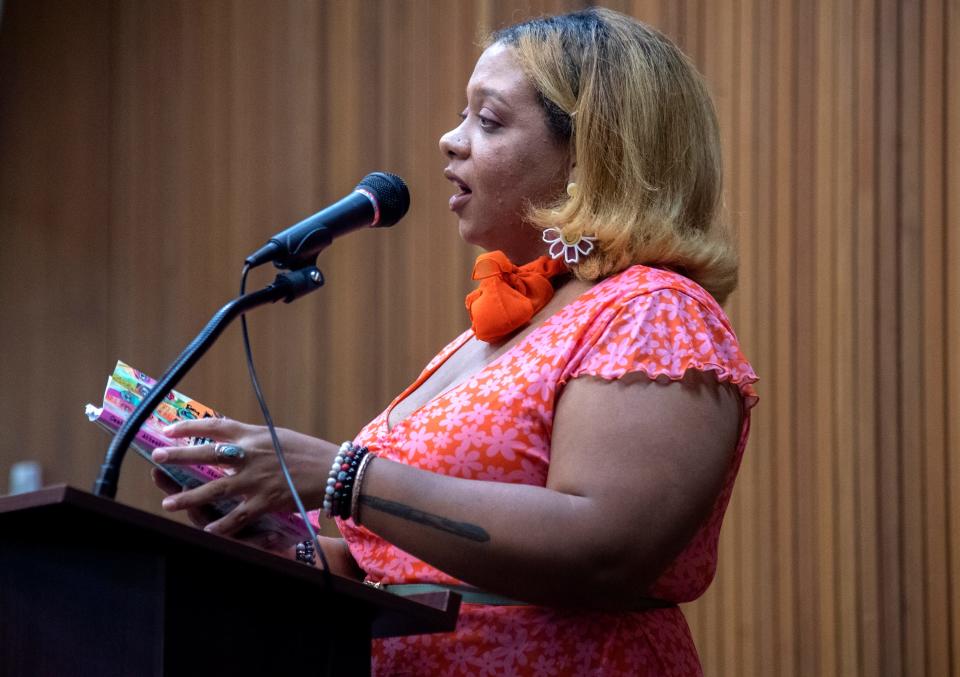 New Stockton poet laureate Jazmarie LaTour recites her poem All Signs Point to Stockton at a live reading of poems from Center of Attention, an anthology of work from local poets published by Tuleburg Press, at the Cesar Chavez Central Branch Library in downtown Stockton on Oct. 7, 2023.