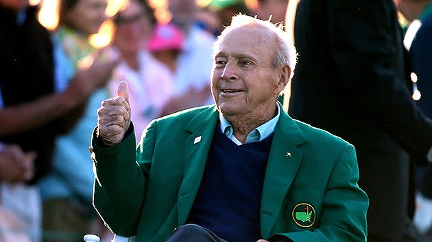 Palmer donning one of his famous green jackets at The Masters. Pic: Getty