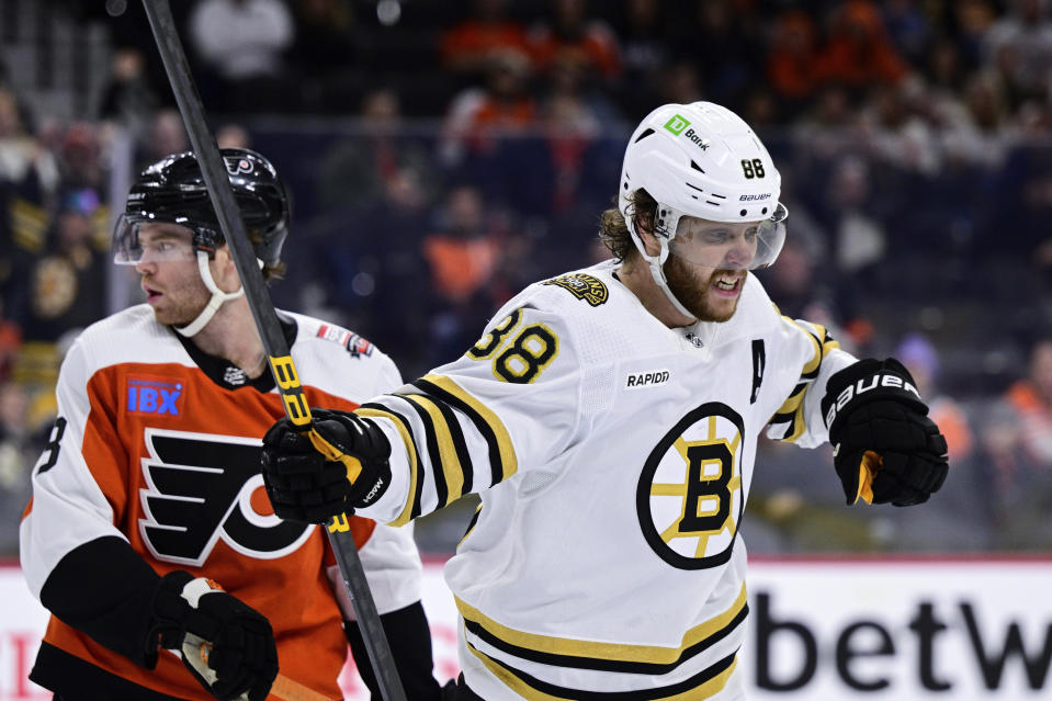 Boston Bruins' David Pastrnak reacts after scoring a goal during the first period of an NHL hockey game against the Philadelphia Flyers, Saturday, Jan. 27, 2024, in Philadelphia. (AP Photo/Derik Hamilton)