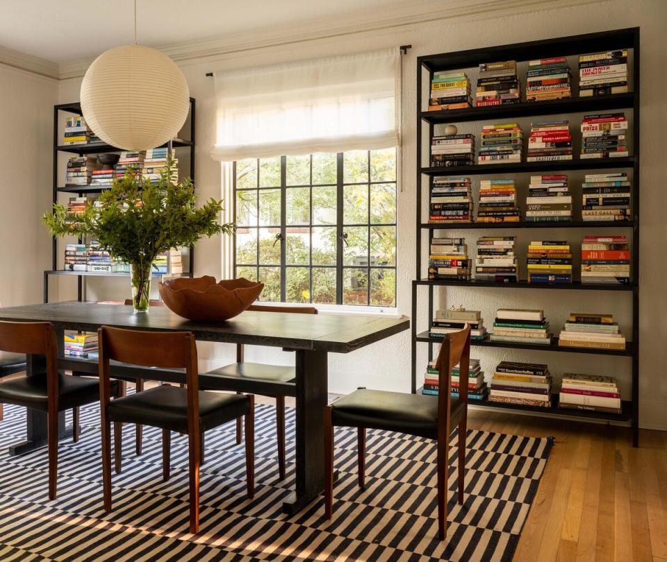 The black-and-white scheme continues in the dining room of Still’s 1920s Tudor home