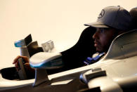 Mercedes' Lewis Hamilton of Britain sits in a driving simulator at a publicity event ahead of the Singapore F1 Grand Prix Night Race in Singapore September 14, 2016. REUTERS/Edgar Su