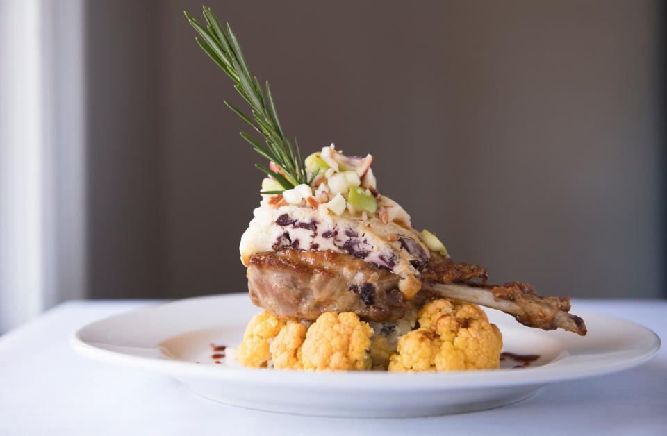 Berkshire pork chop with apple-bacon salsa and Quoxein Farms cranberry Stilton is an entrée option at Braddock's Tavern in Medford.