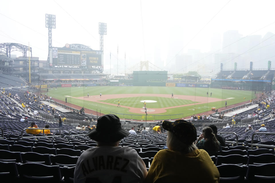 Smoke from Canadian wildfires hangs over downtown Pittsburgh and PNC Park prior to Thursday's Pirates-Padres game. (AP Photo/Gene J. Puskar)