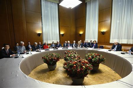 European Union foreign policy chief Catherine Ashton (2nd R) speaks with Iranian Foreign Minister Mohammad Javad Zarif (R) during a photo opportunity before the start of two days of closed-door nuclear talks at the United Nations European headquarters in Geneva November 20, 2013. REUTERS/Denis Balibouse