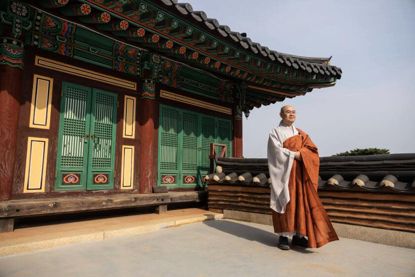 Myojang, he president of the Korean Buddhist Foundation for Social Welfare, poses for a photograph inside Jeondeung Temple.