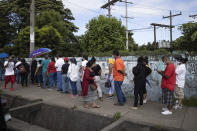 People wait in line to be vaccinated with the AstraZeneca COVID-19 vaccine, in Managua, Nicaragua, Monday, Sept. 20, 2021. (AP Photo/Miguel Andres)